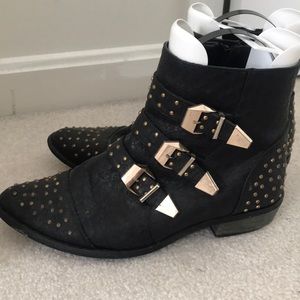 Black booties with gold detailing and buckles